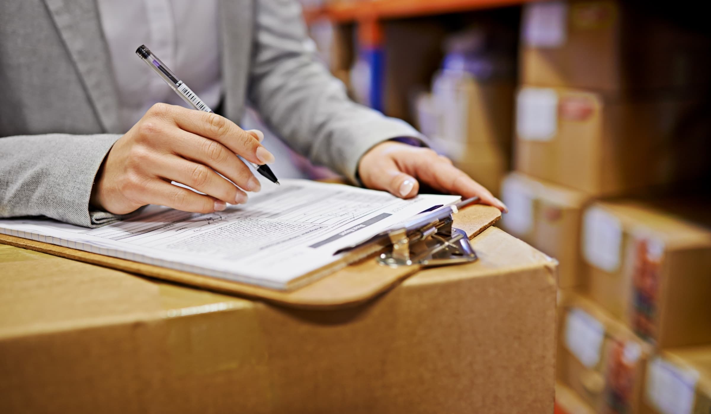 Logistics paperwork being reviewed for customs clearance documentation