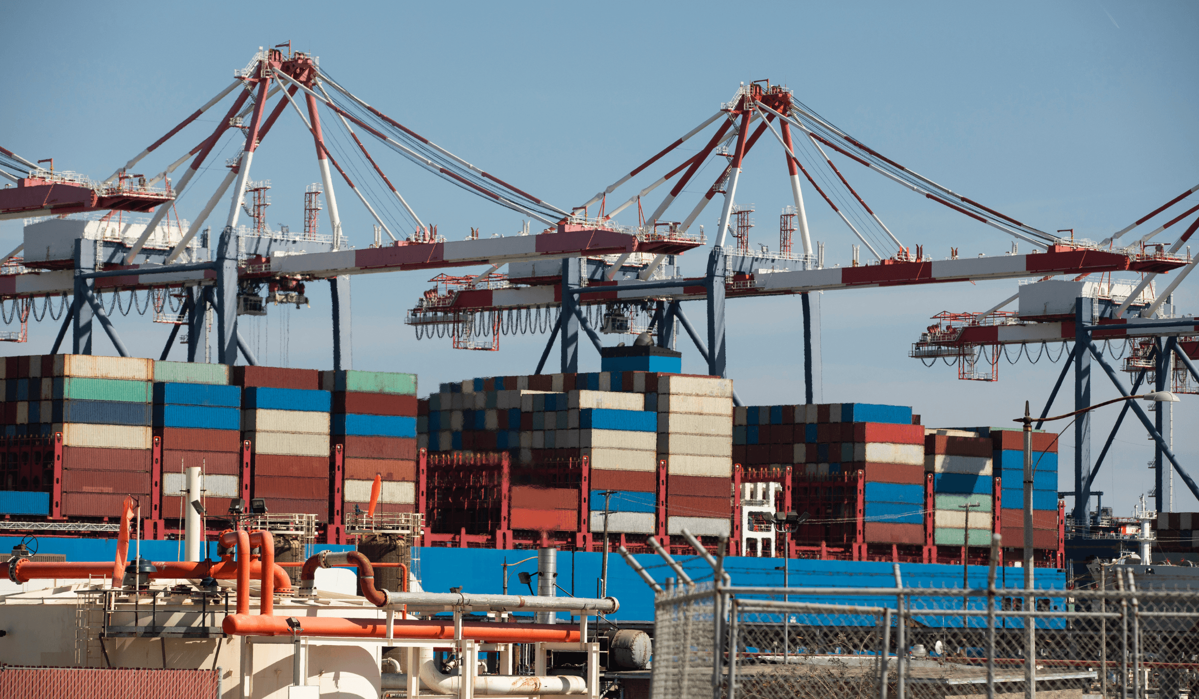 Container ship and port cranes showing active shipping operations