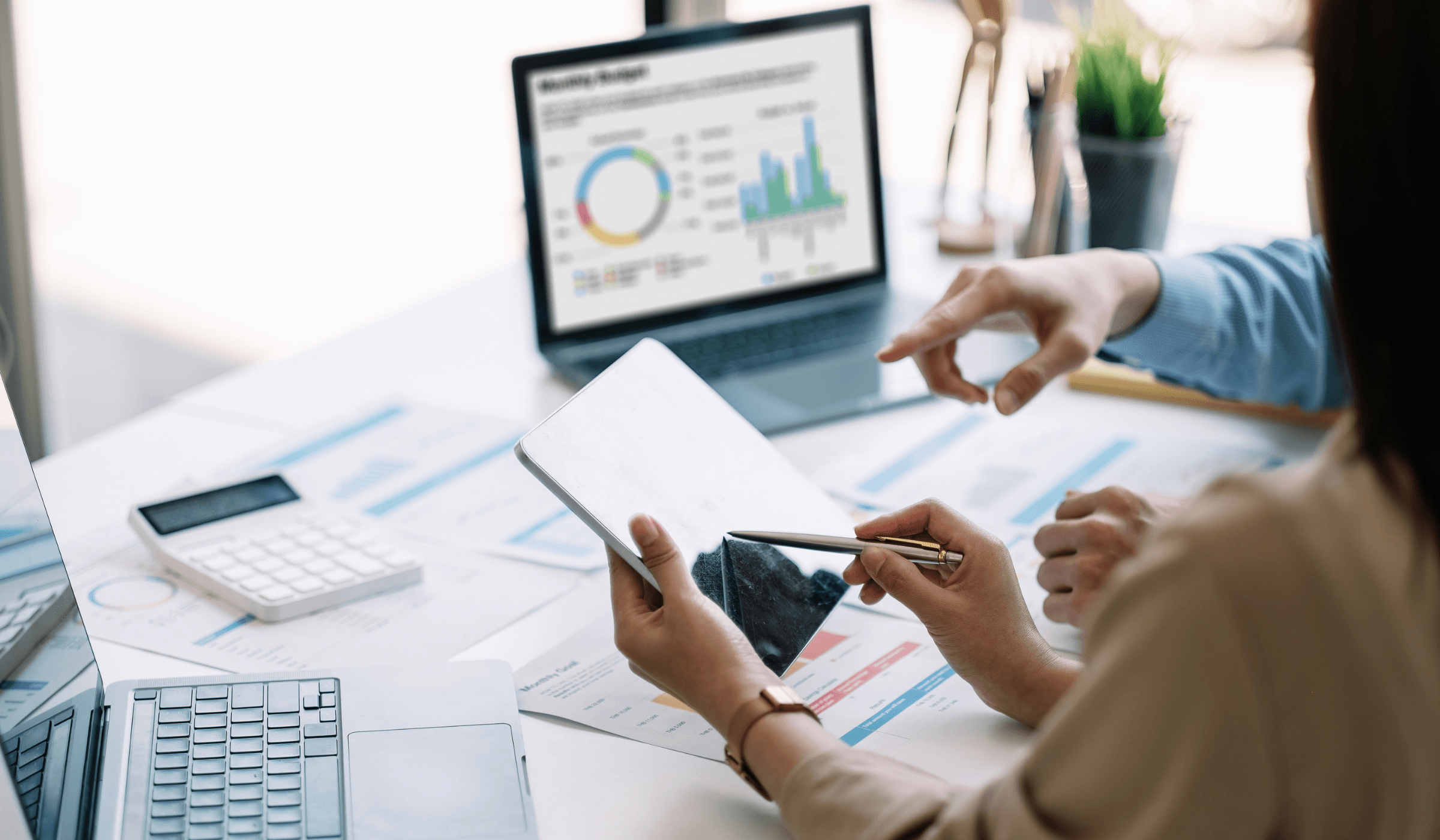 Business analysts reviewing company market intelligence reports and dashboard data